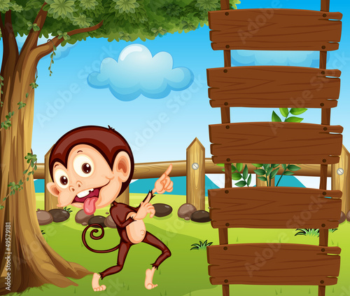 A monkey pointing at the empty signboard