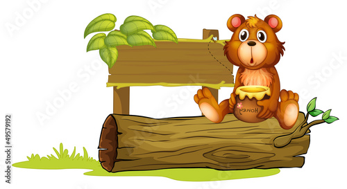 A bear sitting on a trunk