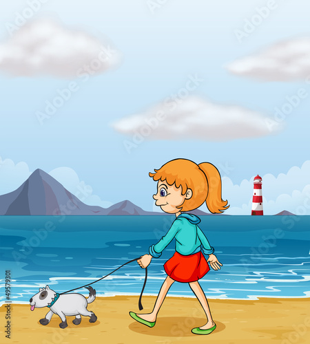 A girl strolling at the beach with a puppy