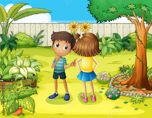 A boy and a girl arguing in the garden