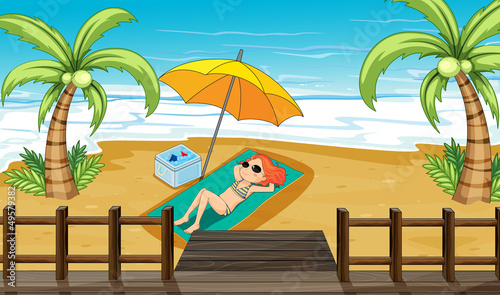 A girl sunbathing at the shore