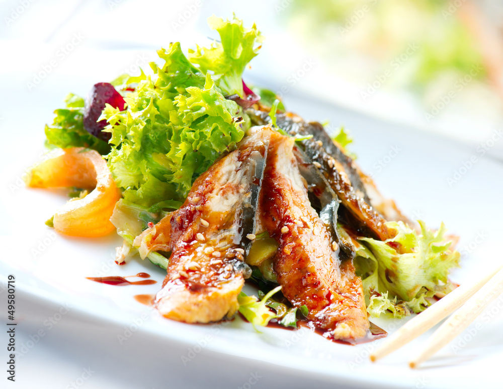 Salad With Smoked Eel with Unagi Sauce. Japanese Food Salad With Smoked Eel with Unagi Sauce. Japanese Food