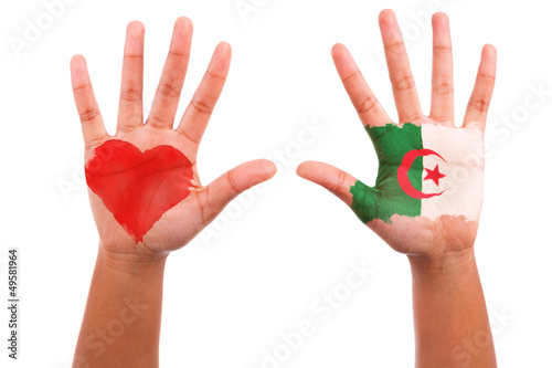 African hands with a painted heart and algerian flag, i love alg
