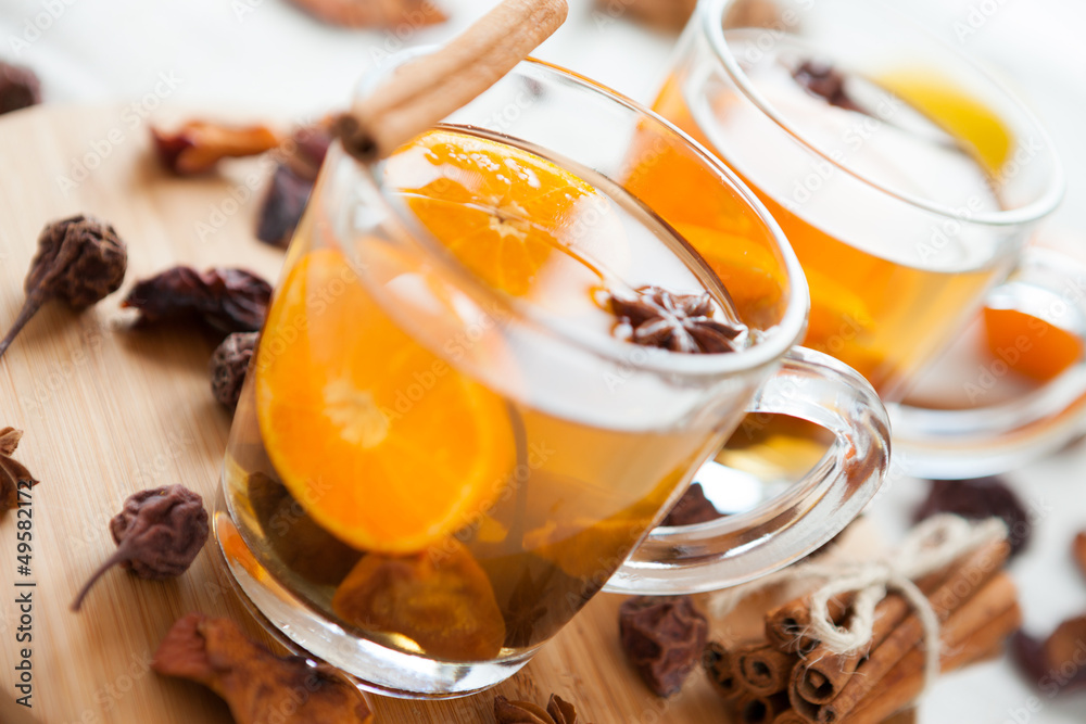 two cups with dried fruit compote and orange