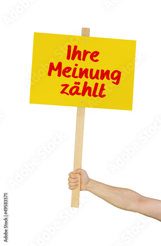 Person hält Schild mit der Aufschrift Ihre Meinung zählt