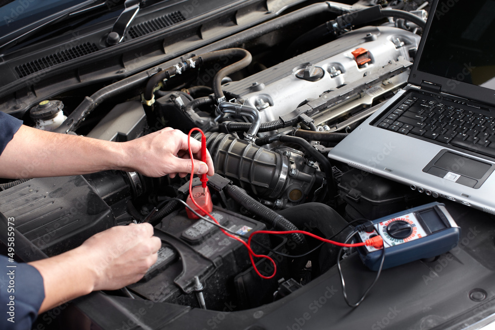 Car mechanic working in auto repair service. Car mechanic working in auto repair service.