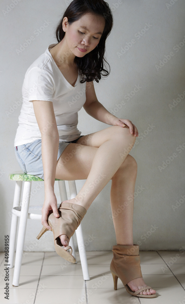 long woman legs wearing high heels shoes