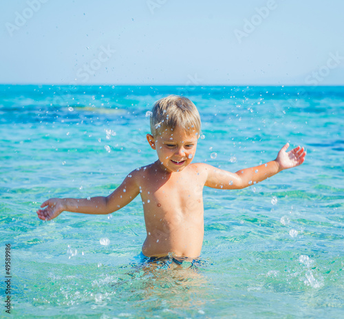 Young boy swimming in sea © Max Topchii