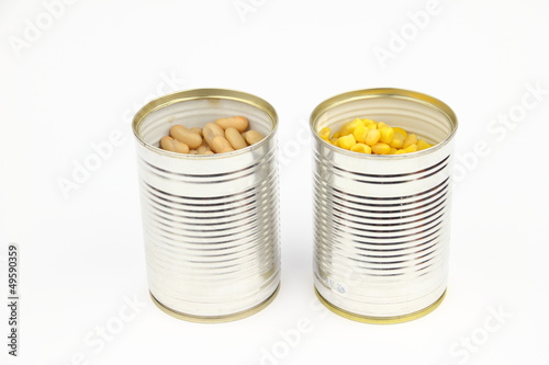 The tins with bean, corn on the white background