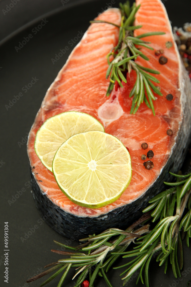Fresh salmon steak on pan, close up Fresh salmon steak on pan, close up