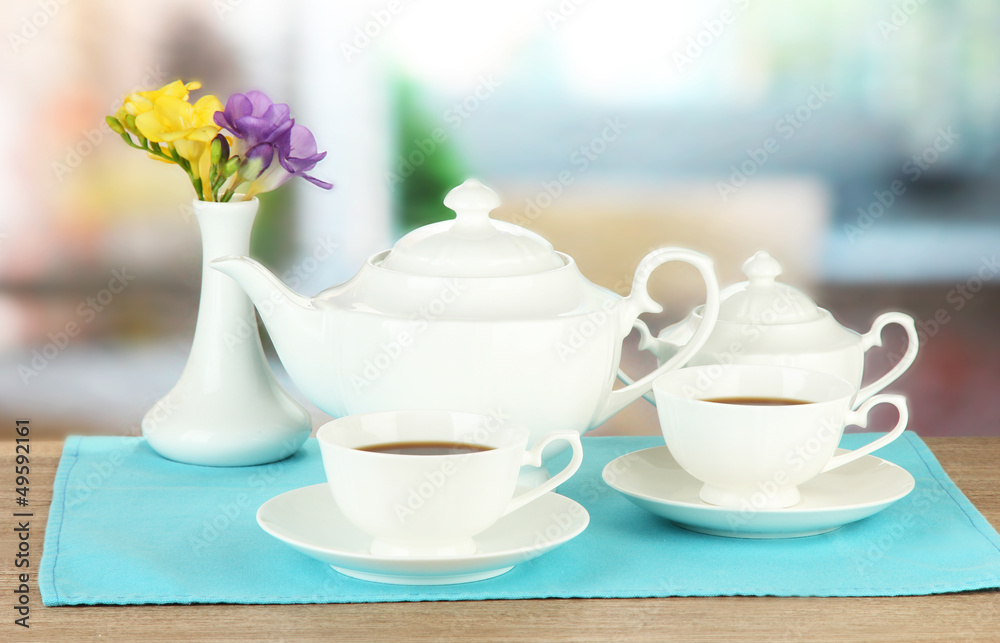 Beautiful tea service on wooden table Beautiful tea service on wooden table