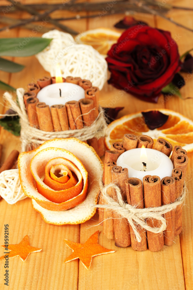 Decorative rose from dry orange peel and burning candles Decorative rose from dry orange peel and burning candles