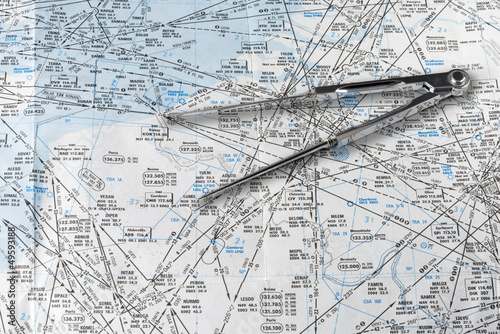 Fotografija A pair of compasses on an aeronautical navigational chart