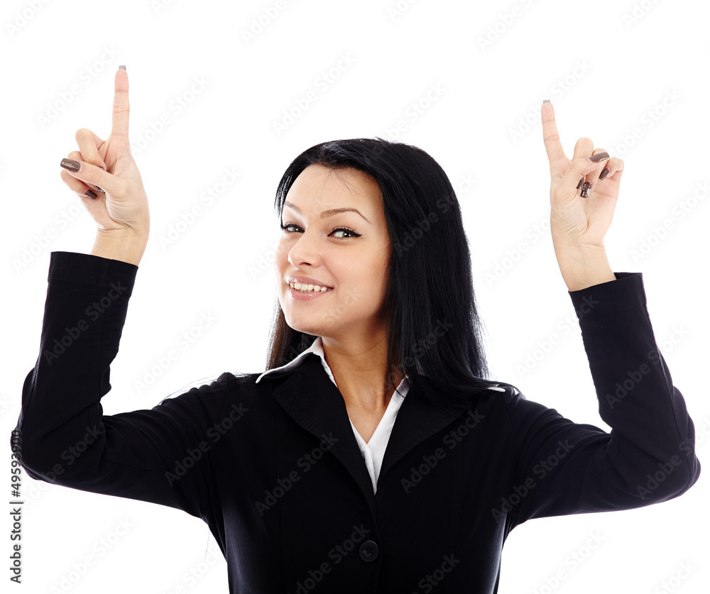 Closeup of smiling young businesswoman pointing to the top of th Closeup of smiling young businesswoman pointing to the top of th