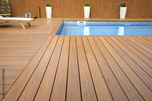 BLUE SWIMMING POOL WITH WOOD FLOORING-PISCINA MADERA photo