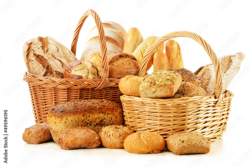  Bread and rolls in wicker basket isolated on white