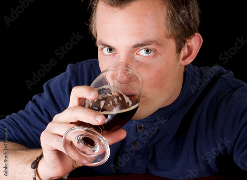 man drinking a beer