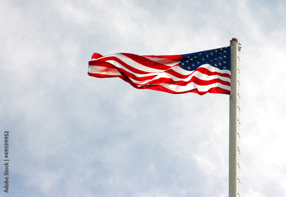 american flag on pole with cloudy overcast sky american flag on pole with cloudy overcast sky