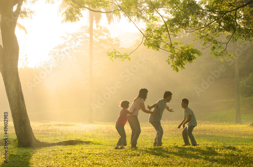 chinese family having quality time playing at outdoor park