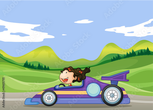 A young girl driving a car