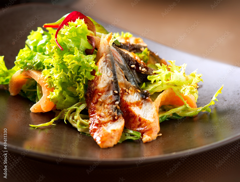 Salad With Smoked Eel with Unagi Sauce. Japanese Food Salad With Smoked Eel with Unagi Sauce. Japanese Food