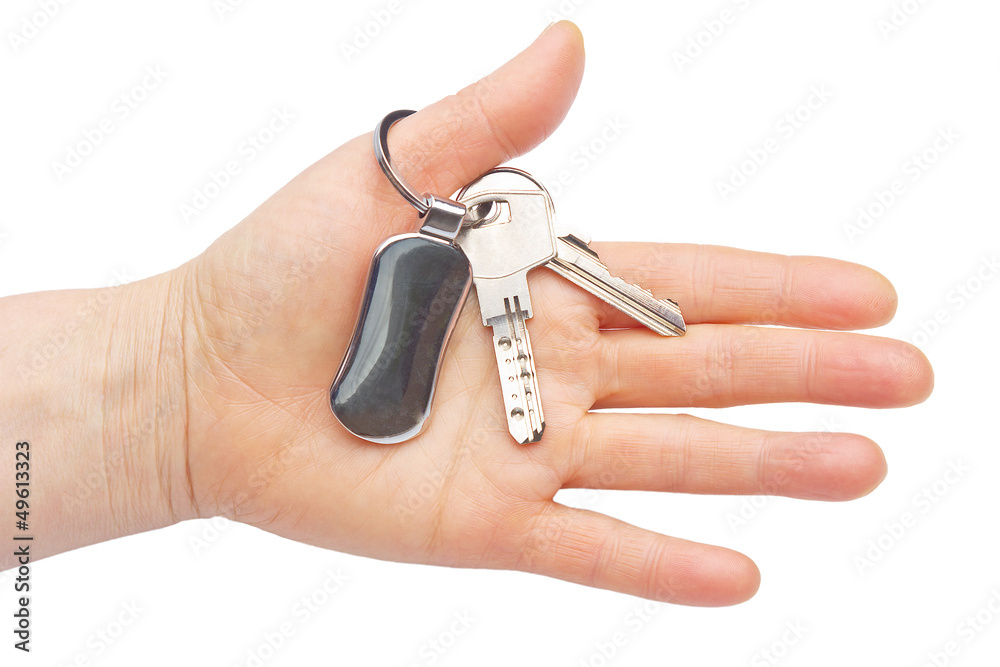 Hand with keys isolated on white