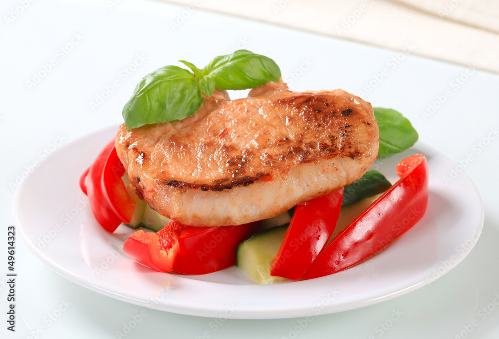 Pork cutlet with red pepper and zucchini sticks