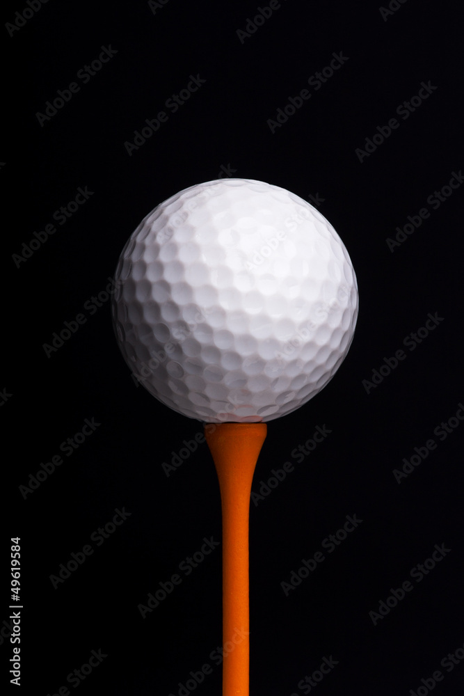 golf tees with ball on black background golf tees with ball on black background