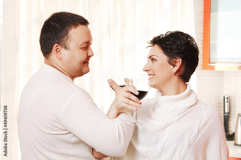 Family in home kitchen drinking wine. Brotherhood Family in home kitchen drinking wine. Brotherhood