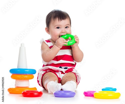 cheerful baby girl playing ...