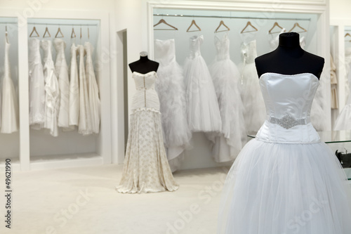 Collection of wedding dresses in the shop photo