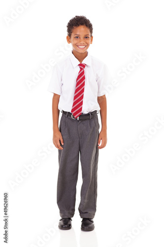 Bilde på lerret cute elementary schoolboy in uniform isolated on white