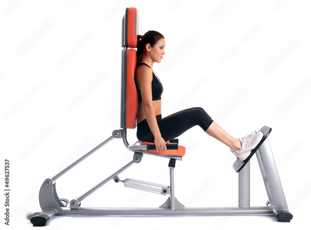 Fototapeta premium Slim brunette on modern isodynamic trainer