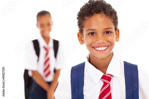 Φωτογραφία cute elementary schoolboy in front of classmate