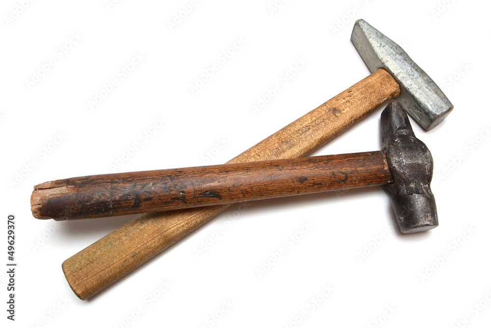 On a white background are two hammers, old and new