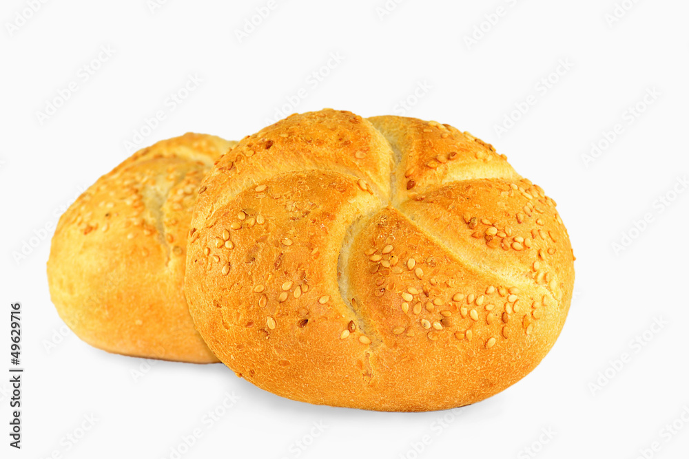 Buns with sesame seeds on white