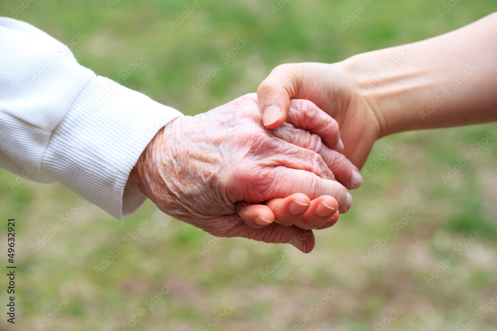 Senior and Young Women Holding Hands Senior and Young Women Holding Hands