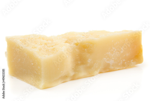 Piece of parmesan cheese isolated on white