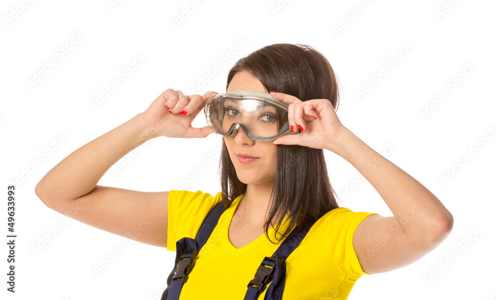 Serious female construction worker with goggles Serious female construction worker with goggles