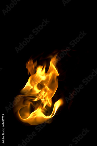 isolated fire flames on black background, darkness