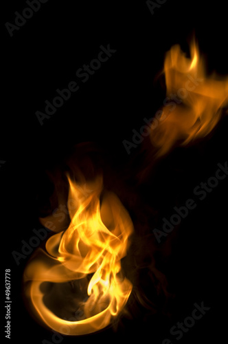 isolated fire flames on black background, darkness © mtkang