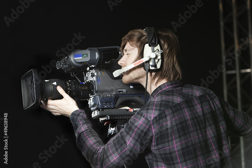 Man operating a TV Studio Camera