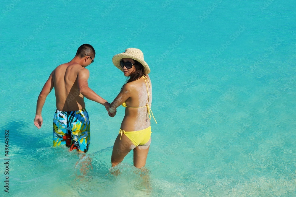 happy young couple enjoying summer on beach happy young couple enjoying summer on beach