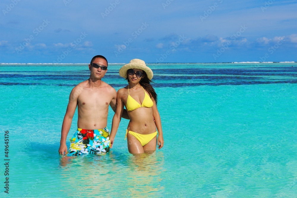 happy young couple enjoying summer on beach happy young couple enjoying summer on beach