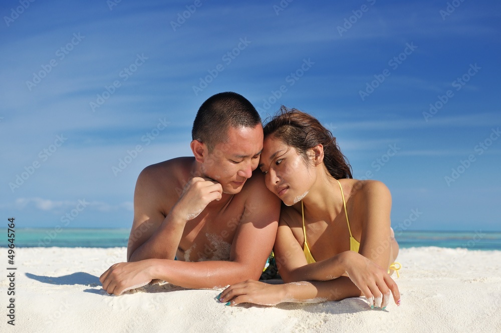 happy young couple enjoying summer on beach happy young couple enjoying summer on beach