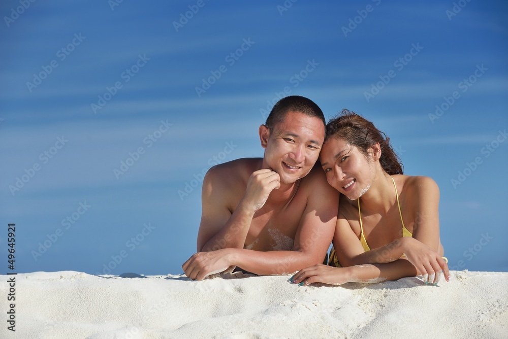 happy young couple enjoying summer on beach happy young couple enjoying summer on beach