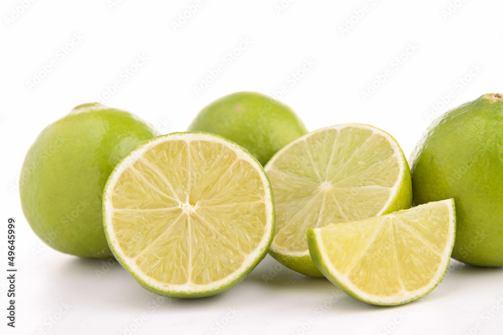 green lemon isolated on white