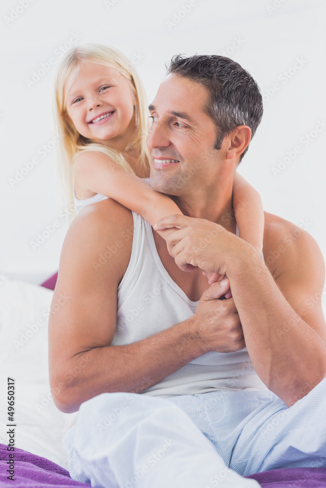 Father and his daughter doing piggy-back Father and his daughter doing piggy-back