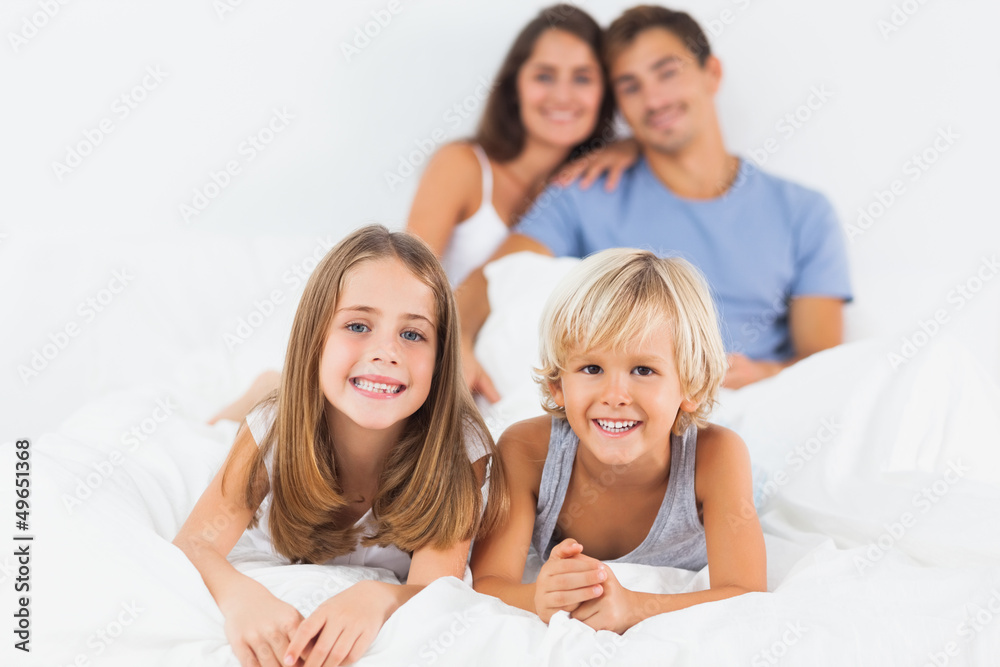 Children lying on the bed