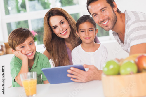 Happy family using a tablet pc